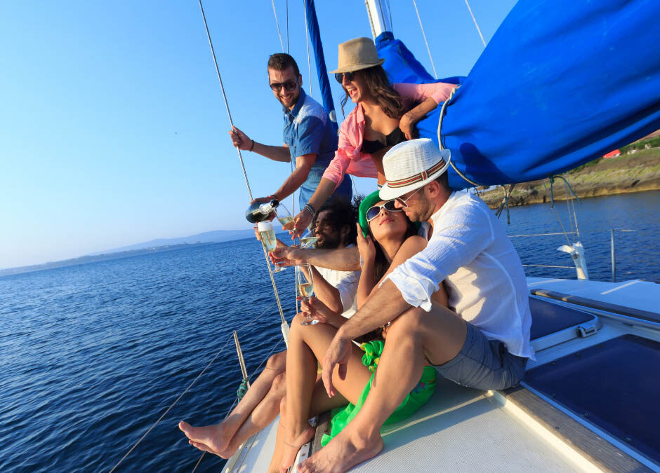 A diverse group of people enjoying a sunny day on a sailboat, smiling and engaging with each other